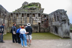 Tourists inside the Principal Temple, Machu Picchu Peru