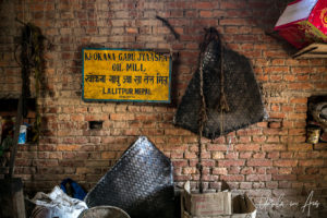 Brick wall and Khokana Gabu Jaaysha sign, mustard factory, Nepal