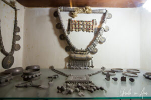 Silver jewellery in a display, Bait Al Na’aman, Oman