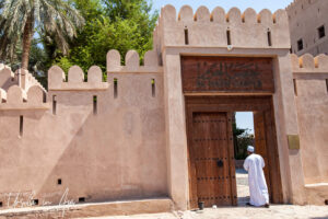 Omani man in the entry to Al Hazm Castle, Oman