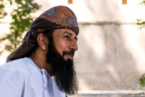 Portrait: Bearded Omani man in a massar, Al Hazm Castle, Oman