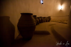 Large earthen pots in a dark room, Al Hazm Castle, Oman