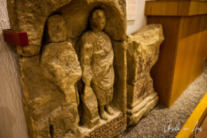 Two simple men carved in stone, National Roman Legion Museum in Caerleon, Wales