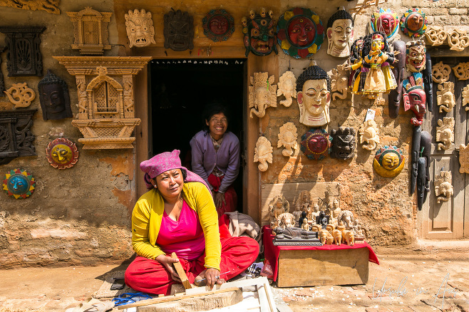 Woman selling wood carvings, Bungamati, Nepal
