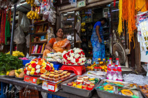 Woman tending an outside shop, Chennai, Tamil Nadu India