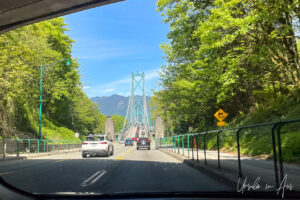 Cars driving north on Lions Gate bridge, Vancouver BC Canada.