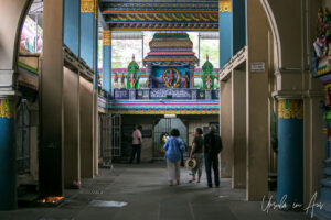 Visitors walking inside Vedapureeswarar Temple, Pondicherry India.