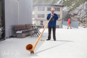 Old man with an alpine horn, Pilatus Switzerland.
