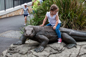 Child on a metal iguana, Taronga Zoo, Sydney, Australia