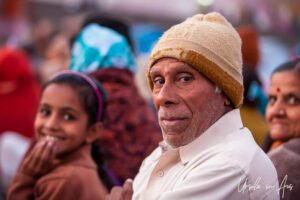 Environmental portrait: Indian man in a woolen cap, Haridwar