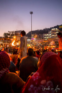 Hindu priest on a Haridwar ghat with a flame, India