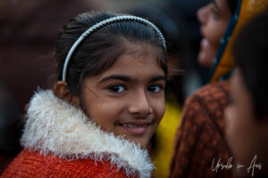 Environmental portrait: a girl in the crowd, Haridwar ghats India