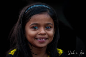 Environmental portrait: a girl in the crowd, Haridwar ghats India
