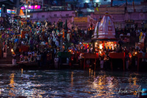 Lights, flames, Hindu priests, and lay-people crowded onto Har Ki Pauri ghat after dark, Haridwar, India