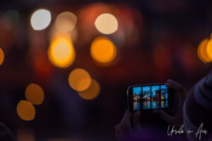 Mobile phone screen at the after dark Ganga Aarti, Haridwar, India