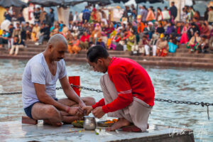 Two men making an offering, Ganges, Haridwar India