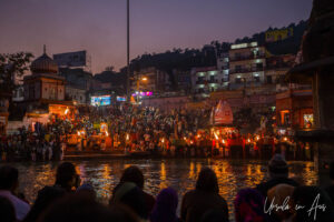 Lights, flames, Hindu priests, and lay-people crowded onto Har Ki Pauri ghat after dark, Haridwar, India