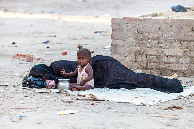 Child with a woman resting, Haridwar India