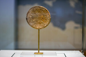 Gold-coloured Phaistos Disc, Heraklion Archaeological Museum, Crete Greece.