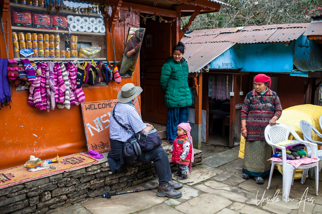 Locals and trekkers in the courtyard, Bhaisikharka Nepal