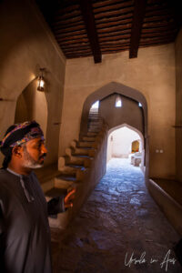 Omani man inside the entry to Nizwa Fort, Oman.