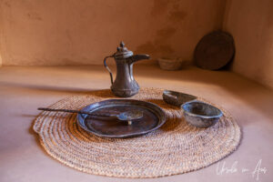 Museum display: antique coffee pot and bowls, Nizwa Fort, Oman