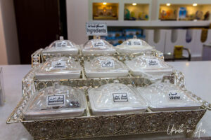 Halwa ingredients in transparent containers, Nizwa Souq, Oman.