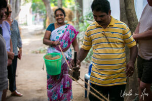 Woman and man twisting coconut fibre into rope, Cuddalore, Tamil Nadu India