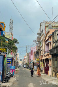 Woman and schoolgirl in a quiet Thanjavur street, Tamil Nadu, India