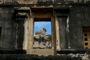 Stone Nandi through a window in the temple wall, Brihadisvara Temple, Thanjavur India