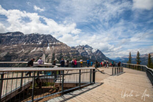 People on a large deck overlooking the mountains around Peyto Lake, Banff Alberta Canada.4