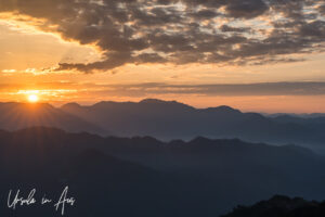 Landscape: Orange sky, a flared sunrise, and popcorn clouds, Kunjapuri Temple, Uttarakhand, India
