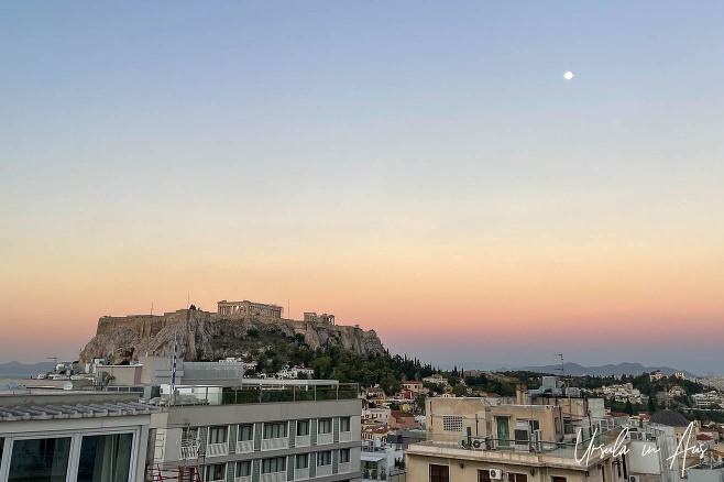 Pink sunrise and fading moon over the Parthenon, Athens, Greece.