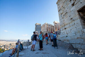 People in the shadows under the Parthenon, Athens, Greece.