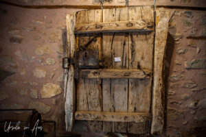 Rough wooden door inside the Monastery Of Agios Stefanos, Meteora, Greece