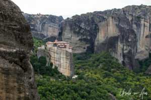 View up at the Monastеry оf St. Barbаra Roussanоu from a walking path, Meteora, Greece