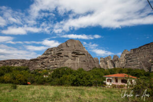 A house at the outskirts of Kastraki with Meteora in the background, Greece