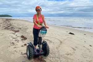 A tourist on a Segway, Four Mile Beach, Port Douglas, Queensland Australia