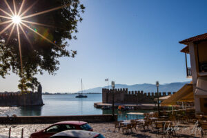 Sun flare, the Venetian port of Nafpaktos, Greece.