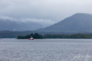 Red working boat on Seaforth Channel, Inside Passage, Canada.