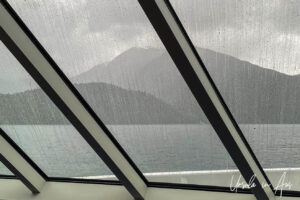 View through a wet window on a wet BC Ferry, Inside Passage, Canada.