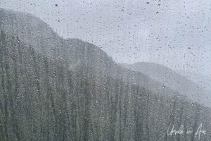 View through a wet window on a wet BC Ferry, Inside Passage, Canada.