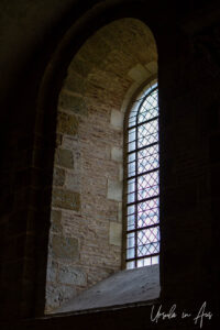 Stained glass arched window, Basilique Saint-Sernin de Toulouse, France