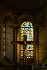 Cross in front of a stained glass window, Basilique Saint-Sernin de Toulouse, France