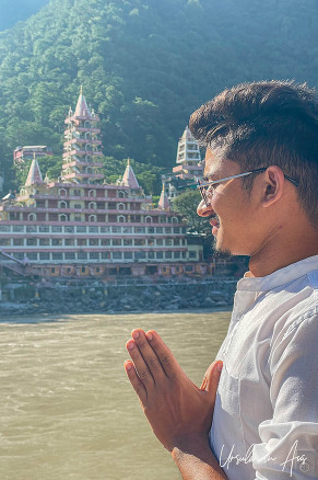Yogi across the Ganges from Trayambakeshwar Temple, Rishikesh, India