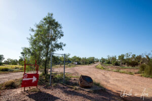 Red car door with a directional arrow on it, Lightning Ridge, NSW Australia