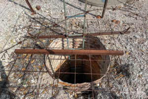 Metal rebar over a hole in the ground, Lightning Ridge, NSW Australia