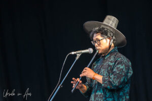 Portrait: Hyunbo Kim on Irish whistle on stage, Vancouver Island Musicfest, Comox BC Canada