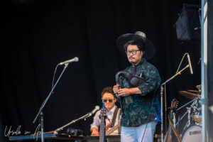Hyunbo Kim on electric bagpipes on stage, Vancouver Island Musicfest, Comox BC Canada
