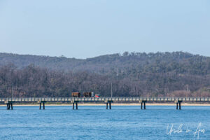 Logging truck on a long wharf, East Boyd Bay, Eden, NSW Australia